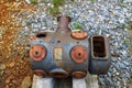 Old rusty engine parts surrounded by rocks and lush green grass and plants at Vickery Creek Royalty Free Stock Photo