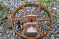 Old rusty engine parts surrounded by rocks and lush green grass and plants at Vickery Creek Royalty Free Stock Photo