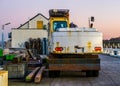 Old rusty excavator from the back, vintage digger machine, construction and ground mover equipment