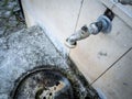 Old rusty faucet on concrete grey wall Royalty Free Stock Photo