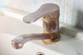 Old  rusty faucet in the kitchen  limestone  scum  need a replacement Royalty Free Stock Photo