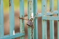 Old rusty fence or gate with chained padlock Royalty Free Stock Photo