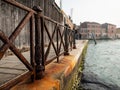 Old rusty fence near canal in Murano