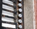 Old rusty flat apartment, abandoned building, house entry phone buttons, object detail, closeup, empty name tags, vacant lot Royalty Free Stock Photo