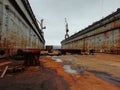 Old rusty floating dry dock. Dry docks are used for the construction, maintenance and repair of ships. Murmansk. Tall Royalty Free Stock Photo