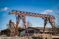 Old rusty gantry crane at abandoned construction site. Royalty Free Stock Photo