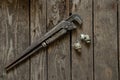 Old rusty gas wrench lies on a wooden table close up Royalty Free Stock Photo