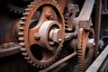 old, rusty gear mechanism interlinked with chains