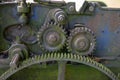 Old rusty gears. Gear wheels in agricultural equipment.