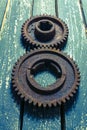 Old rusty gears on a wooden table