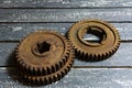 Old rusty gears on a wooden table