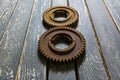 Old rusty gears on a wooden table