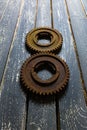 Old rusty gears on a wooden table