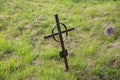 Old rusty grave cross on cemetery in ireland