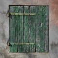 Old rusty green wood shutter