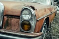 Old rusty grunge retro vintage car with peeling paint close up, abandoned auto Royalty Free Stock Photo