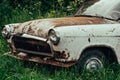 Old rusty grunge retro vintage car with peeling paint close up, abandoned auto Royalty Free Stock Photo