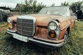 Old rusty grunge retro vintage car with peeling paint close up, abandoned auto Royalty Free Stock Photo