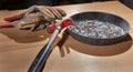 Old rusty hammer and construction gloves laid on wooden board Royalty Free Stock Photo