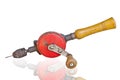 Old rusty hand drill on white background. Royalty Free Stock Photo