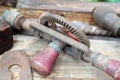 Old rusty hand drill on a wooden workshop table Royalty Free Stock Photo