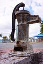 Old rusty hand pump for water. Royalty Free Stock Photo