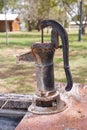 Old rusty hand pump for water. Royalty Free Stock Photo