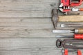 Old rusty hand tools and instruments on wood background Royalty Free Stock Photo