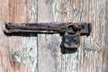 Rusty hinge on a wooden door Royalty Free Stock Photo
