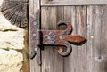 Old rusty hinge on wooden door Royalty Free Stock Photo