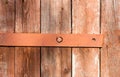 Old rusty hinge on wooden door, Old background for your design Royalty Free Stock Photo