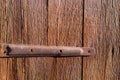 Old rusty hinge on wooden door, Old background for your design Royalty Free Stock Photo