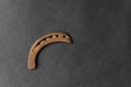 Old rusty horse shoe on black colored background. It is used for to protect a horse hoof from wear Royalty Free Stock Photo