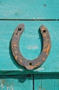 Old rusty horseshoe luck symbol on farm wall Royalty Free Stock Photo