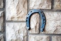 Old rusty horseshoe on a stone background Royalty Free Stock Photo