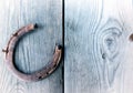 Old rusty horseshoe on vintage wooden board Royalty Free Stock Photo