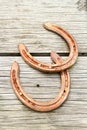 Old rusty horseshoe on wooden board Royalty Free Stock Photo
