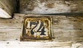 Old rusty house sign number 74 Royalty Free Stock Photo