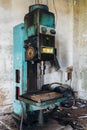 Old rusty industrial drilling machine in abandoned factory workshop looks like robot Royalty Free Stock Photo