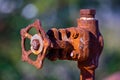 old and rusty industrial liquid control faucet.