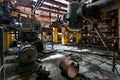 Old rusty Industrial tanks connected by pipes connected with valves in abandoned chemical factory Royalty Free Stock Photo