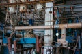 Old rusty Industrial tanks connected by pipes connected with valves Royalty Free Stock Photo