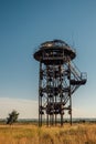 Old rusty iron abandoned watch tower in wastelands Royalty Free Stock Photo