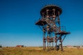 Old rusty iron abandoned watch tower in wastelands Royalty Free Stock Photo