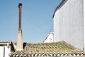 Old rusty iron chimney on the roof of an abandoned house Royalty Free Stock Photo