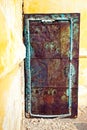 Old rusty iron door in the abandoned concrete house Royalty Free Stock Photo