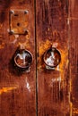 Old rusty iron door with round handle. Royalty Free Stock Photo