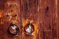 Old rusty iron door with round handle. Royalty Free Stock Photo