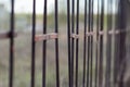 Old rusty iron fence with a shallow depth of field Royalty Free Stock Photo