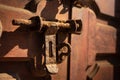 Old rusty iron latch on a wooden door Royalty Free Stock Photo